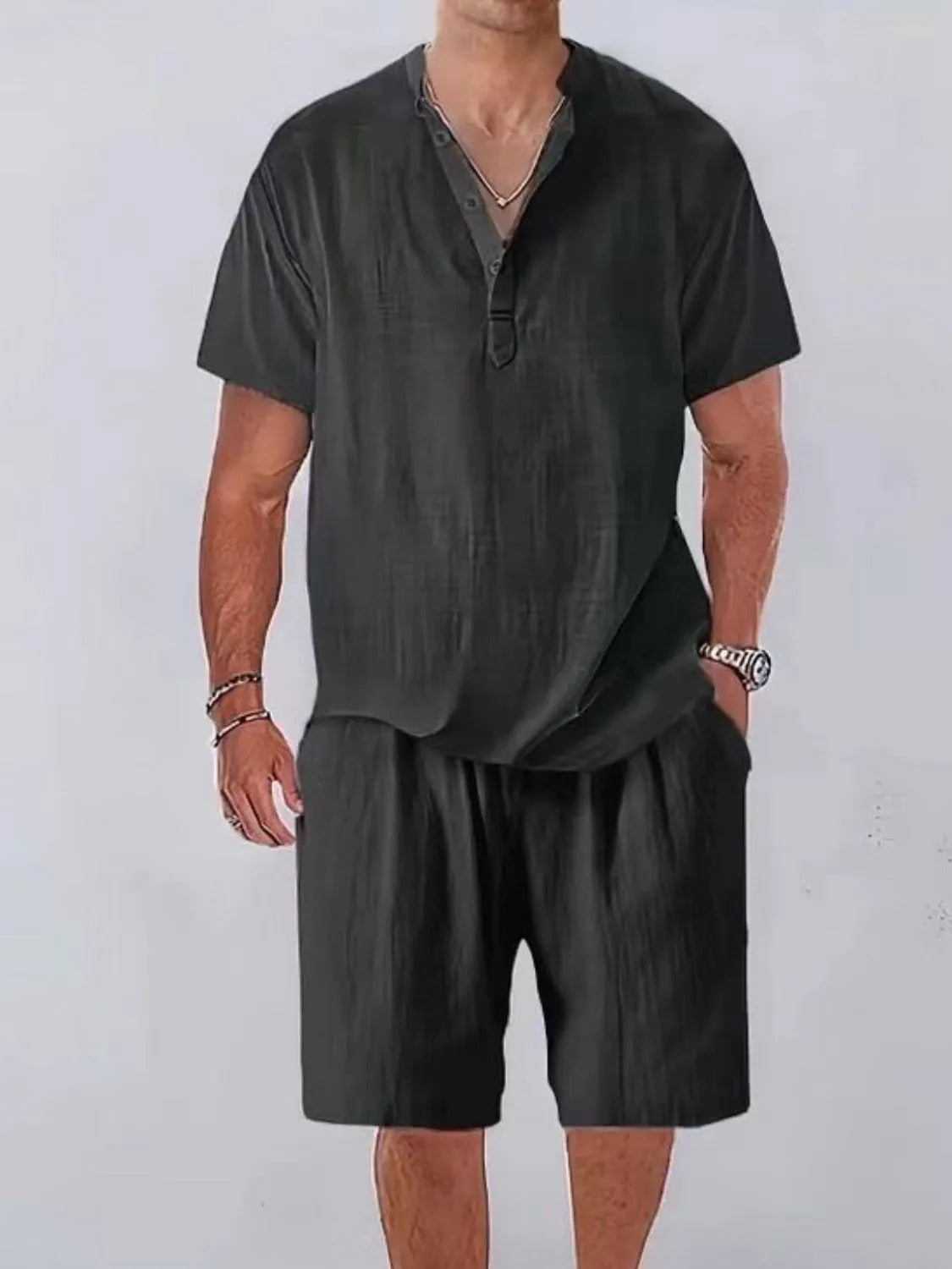 Men's plus size short sleeve top and shorts set with button detail, slightly stretchy polyester.