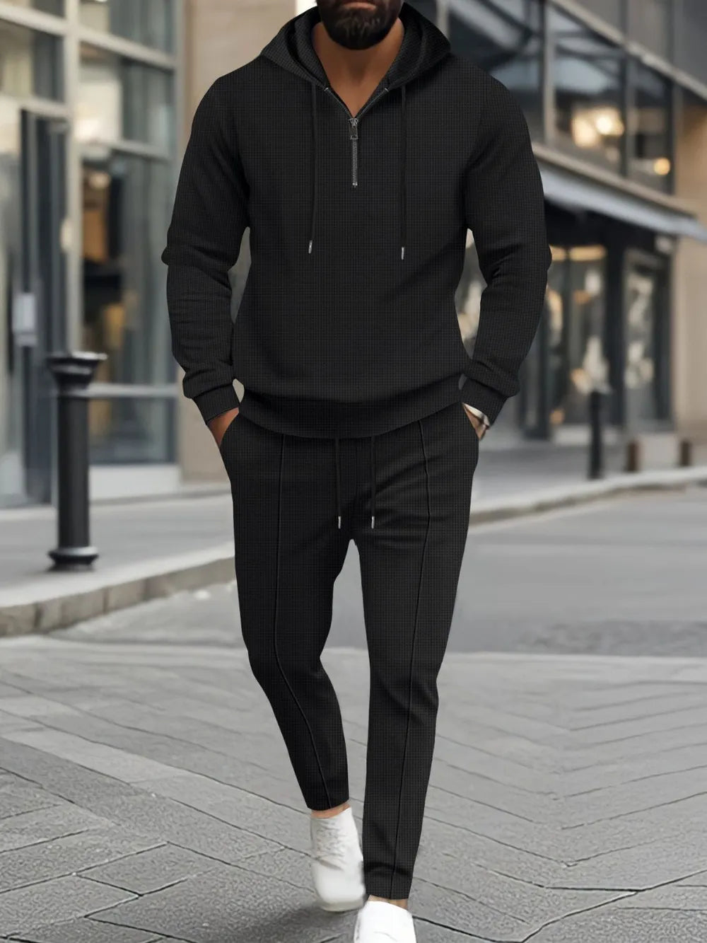 Men's full size waffle-knit half zipper hoodie and pants set in black, featuring drawstring and pockets.