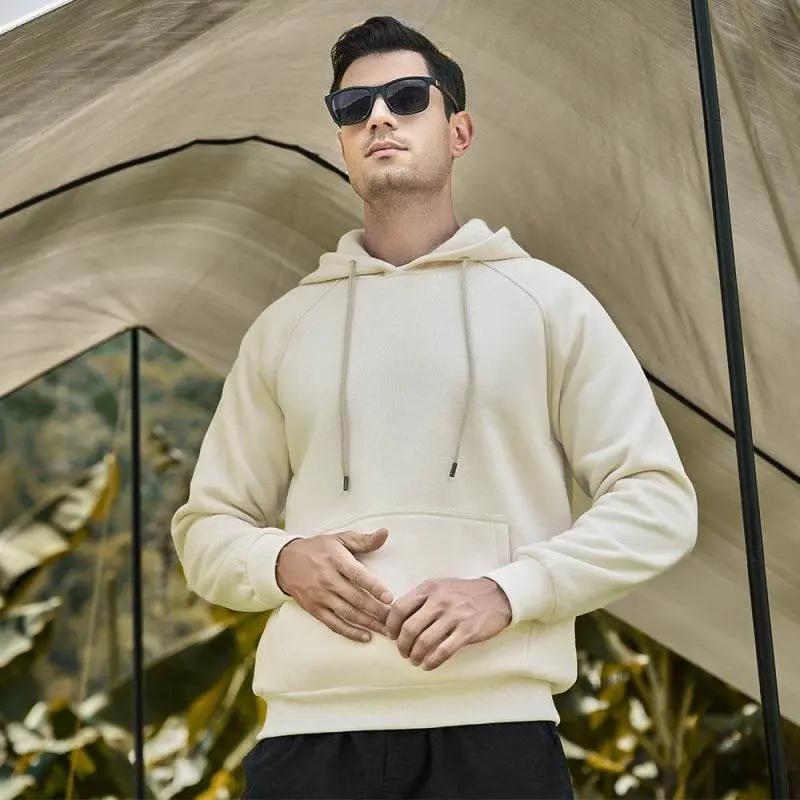 Casual solid color men's hooded sweatshirt, perfect for all-season fashion, featuring premium polyester blend and functional pockets.