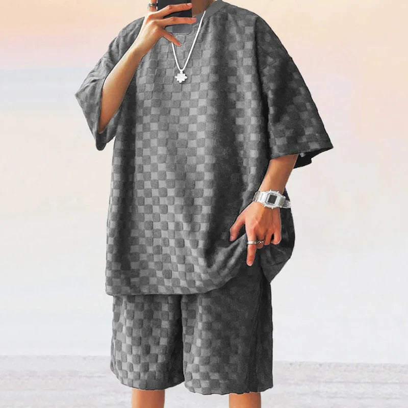 Men Leisure Oversized two-piece shorts set with O-neck collar and drawstring closure.