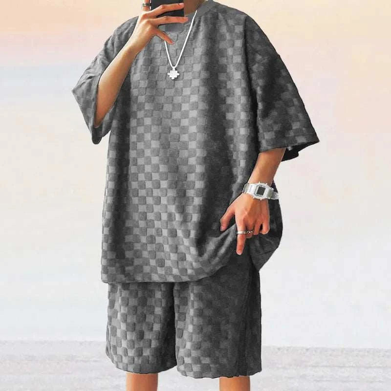 Men Leisure Oversized two-piece shorts set with O-neck collar and drawstring closure.