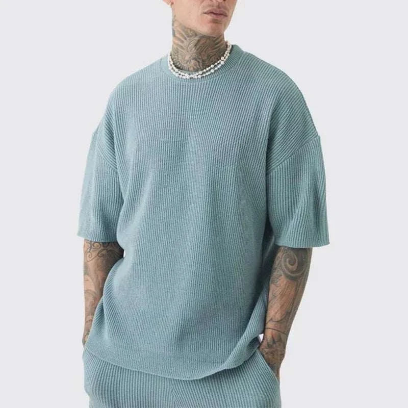 Beach casual street wear men outfit set with knit texture, O-neck collar, and short sleeves.