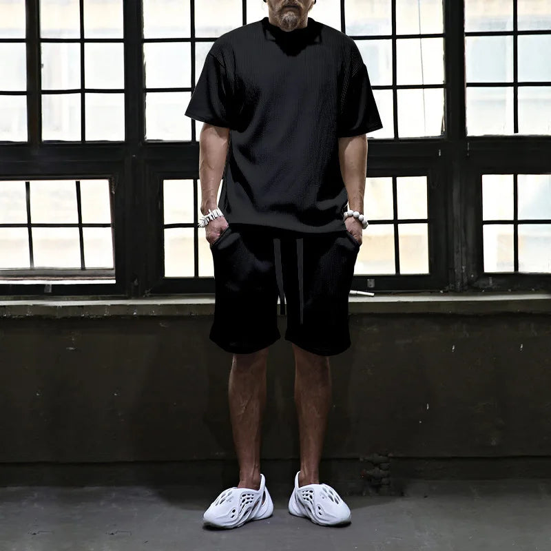 Men's vacation loose beach shorts set with comfortable shorts and stylish top.