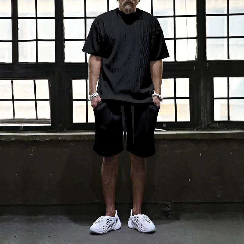 Men's vacation loose beach shorts set with comfortable shorts and stylish top.