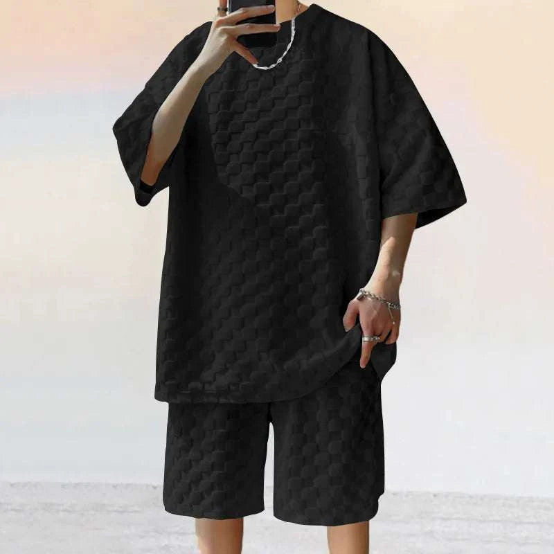 Men Leisure Oversized Two-piece Shorts Set in black with O-neck and drawstring closure.