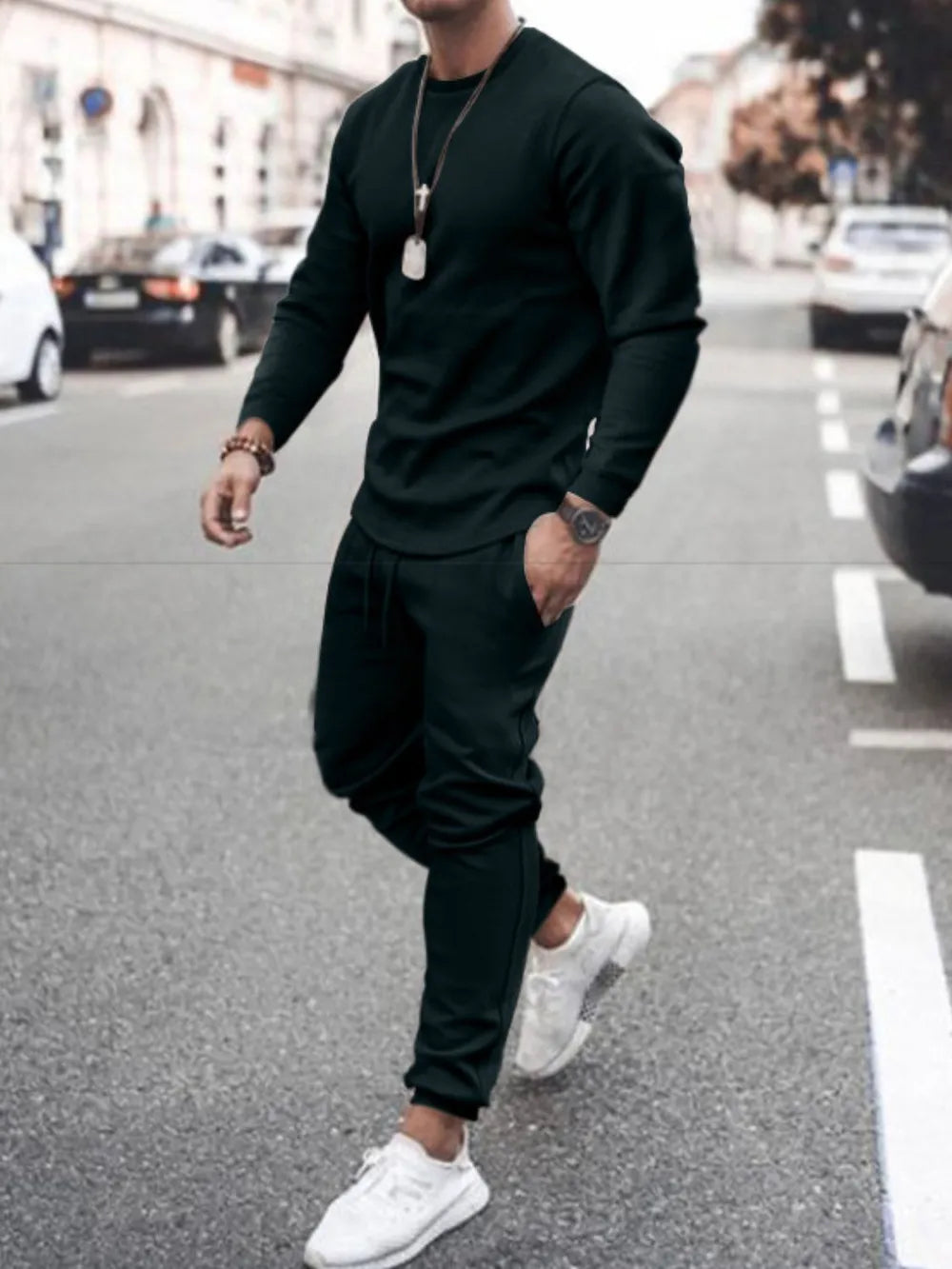 Men's full size round neck long sleeve top and pants set in an outdoor street setting.