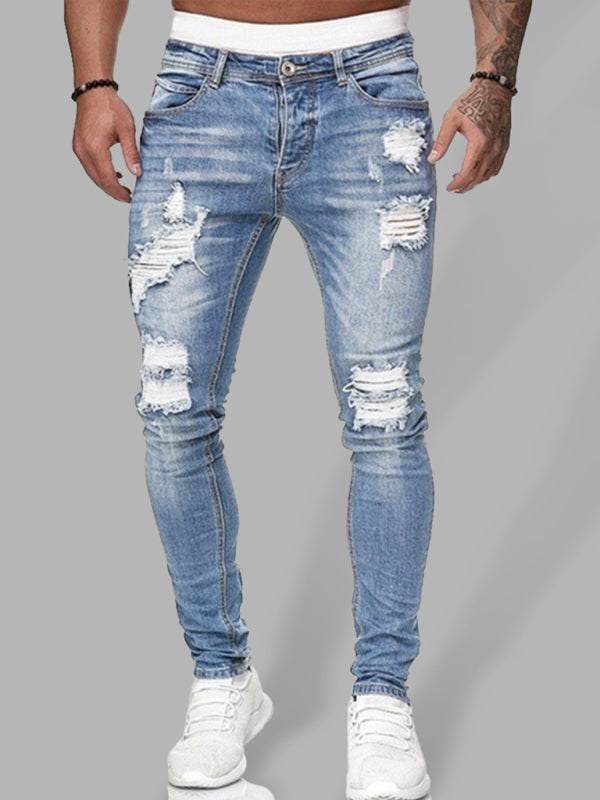 Men's fashion ripped slim skinny jeans in blue denim, featuring distressed details and a mid-waist fit.