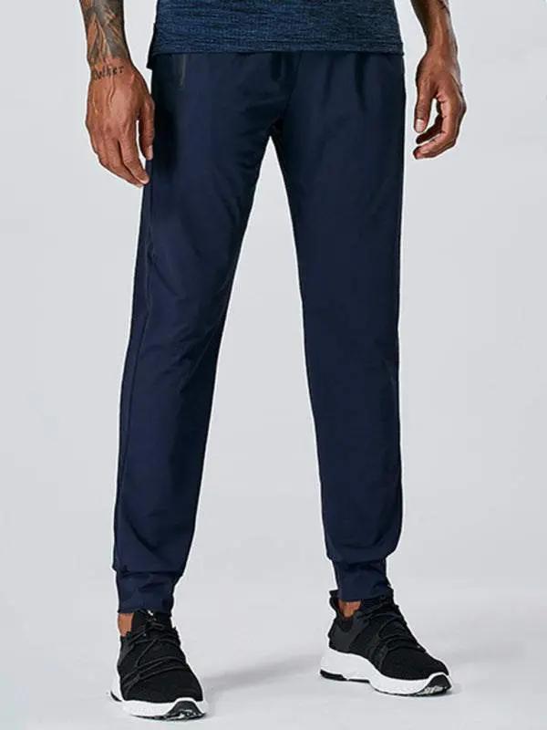 Men's quick-dry fitness elastic zipper pants in navy blue.