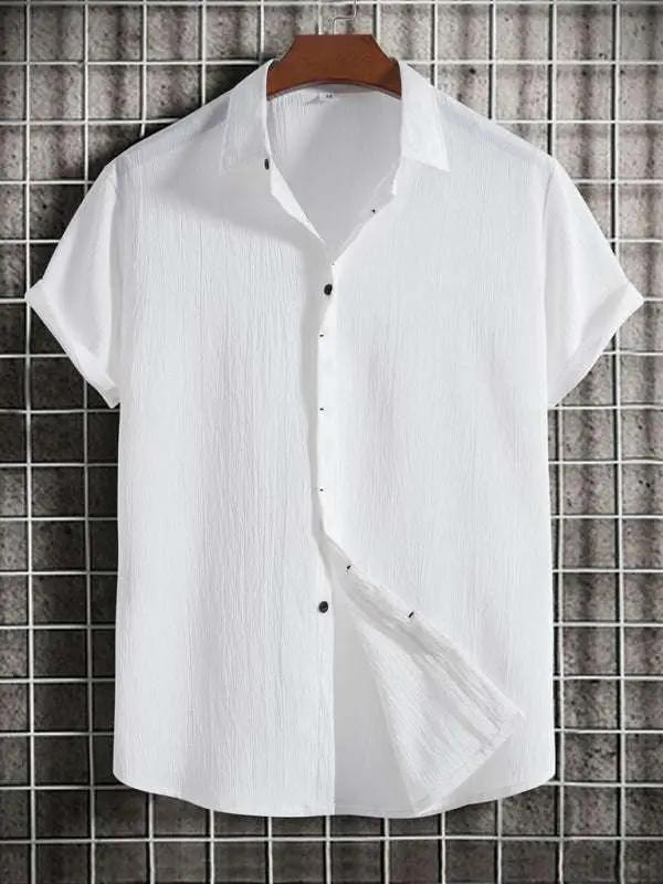 Men's white short sleeve loose solid color button cotton linen shirt hanging.