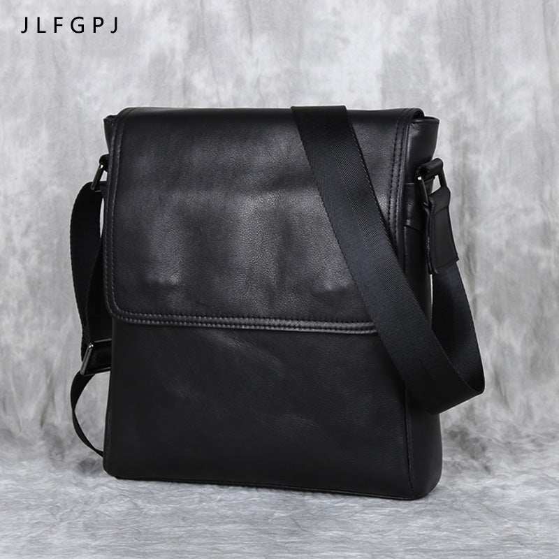 Men's genuine leather crossbody bag in black with adjustable shoulder strap, perfect for everyday essentials.