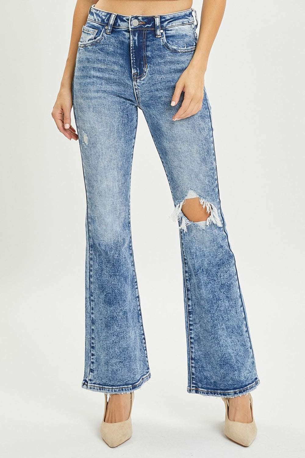 Full size high rise distressed flare jeans with vintage-inspired detailing.