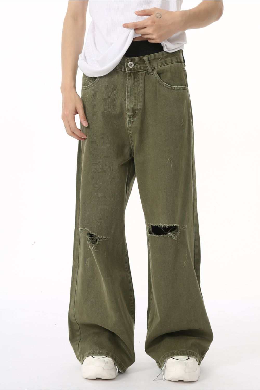 Distressed wide leg jeans with pockets in olive green.