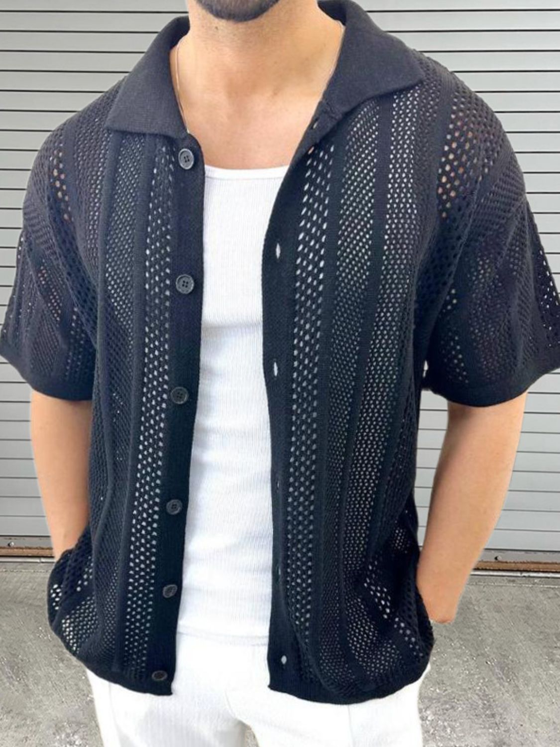 Men's button down collared neck hollow out black shirt with short sleeves.