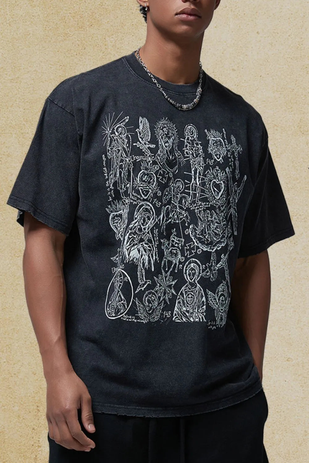 Men's graphic round neck half sleeve t-shirt in black with artistic design, 100% cotton.