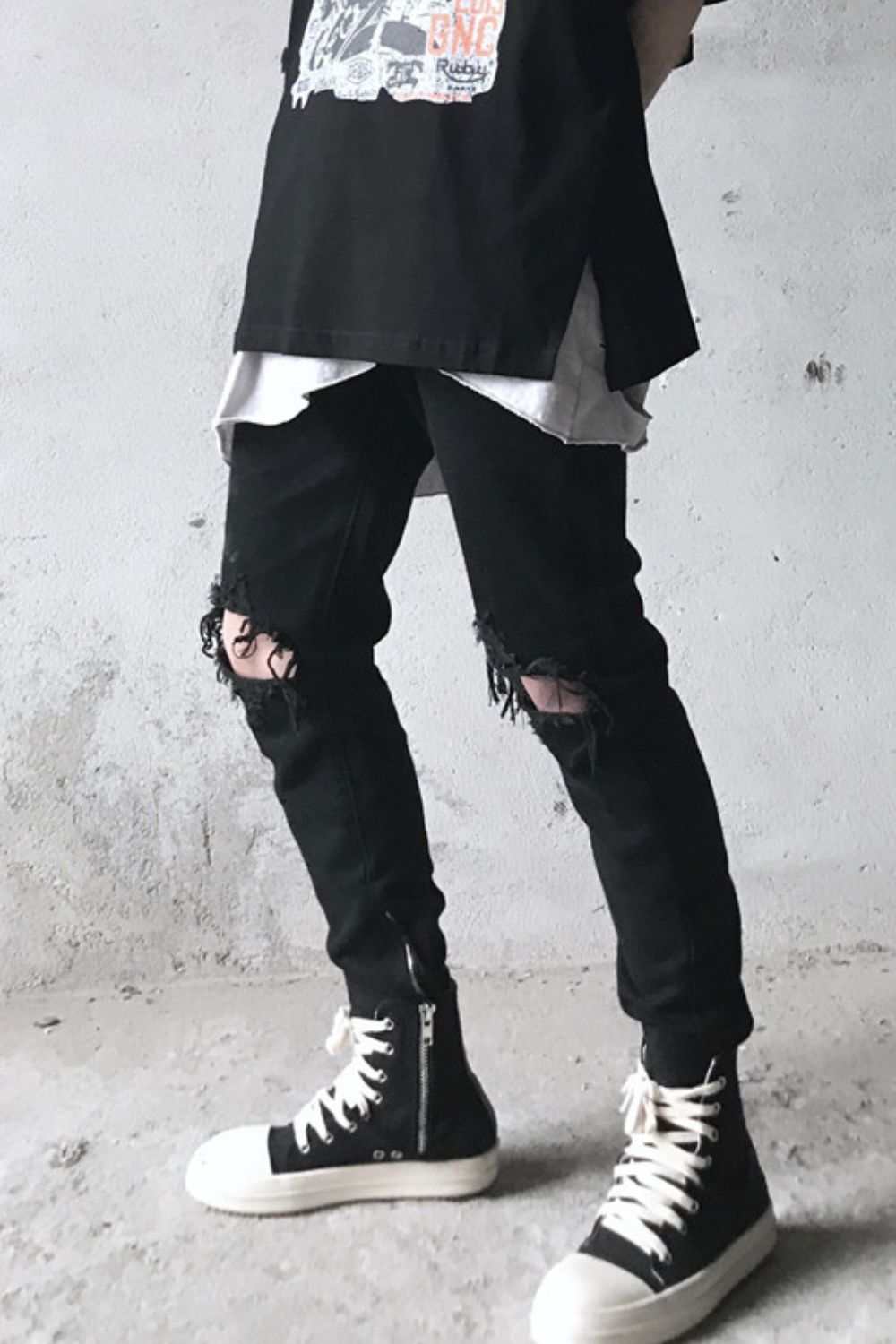 Men's distressed skinny jeans with a basic style, shown in black.
