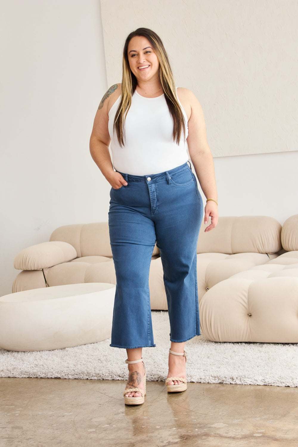 Tummy Control High Waist Raw Hem Jeans on woman in casual setting, flattering fit, moderate stretch.