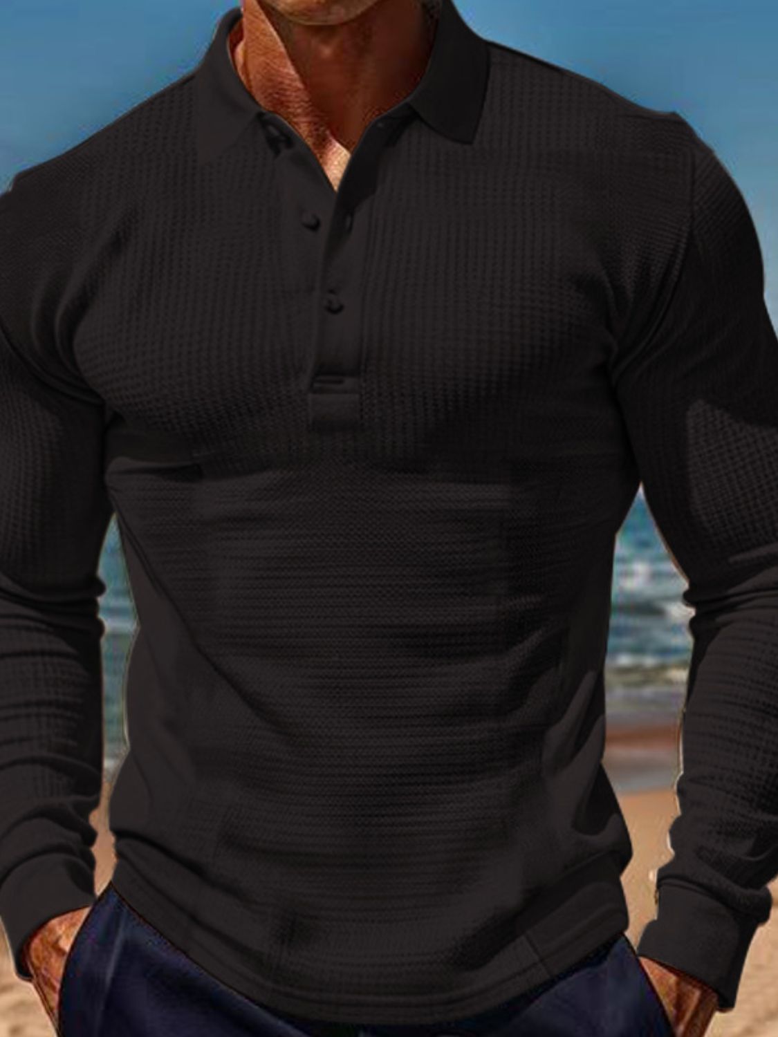Men's full size waffle-knit quarter button polo, plus size, black, stretchy polyester, beach background.