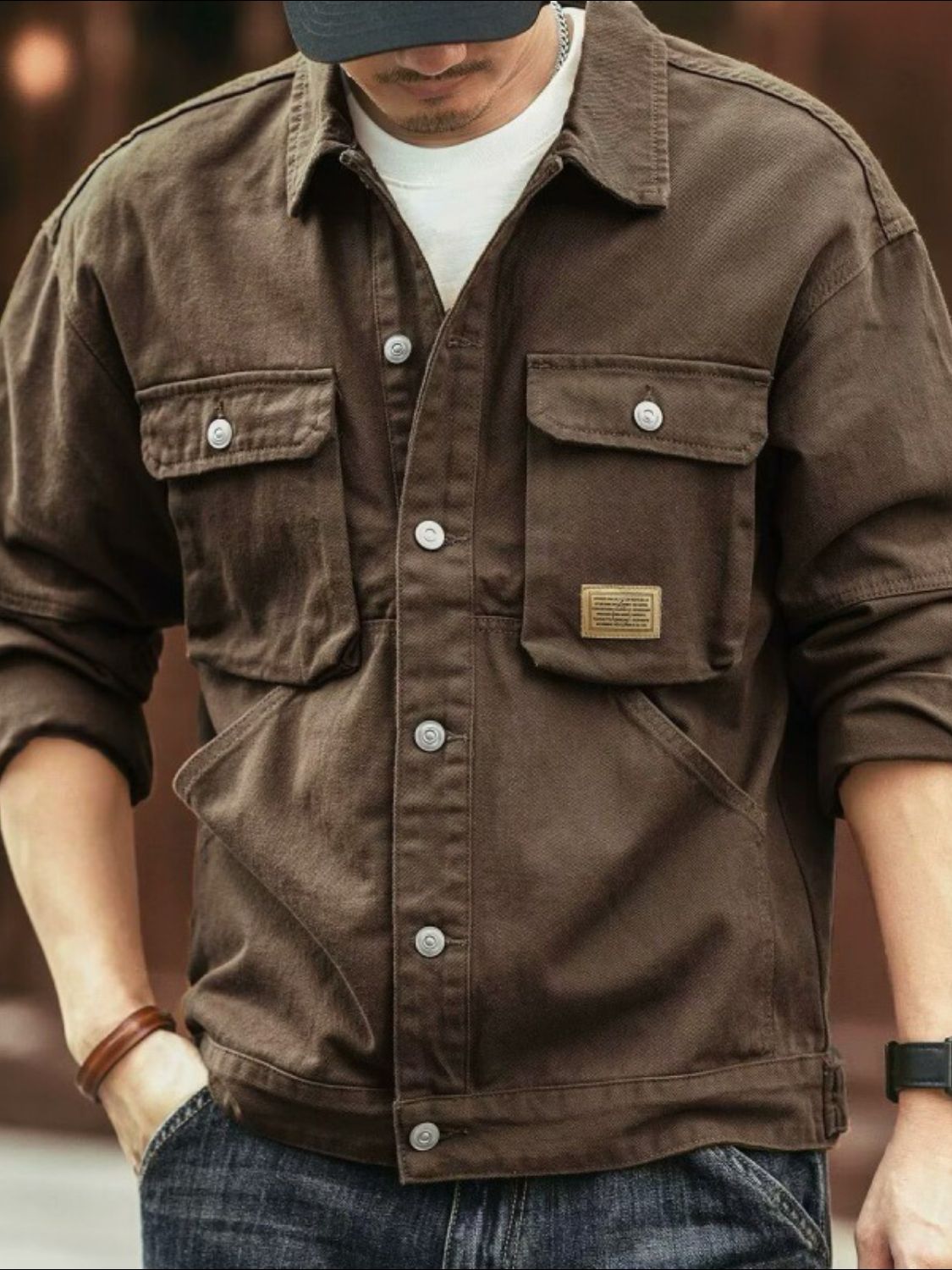 Men's washed collared neck cargo jacket in brown, featuring buttoned pockets and casual style.