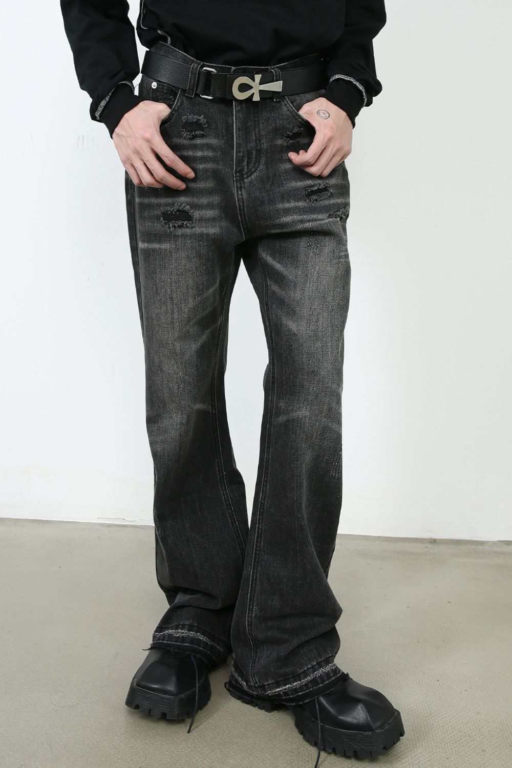 Men's frayed hem bootcut jeans, basic style, no stretch, black footwear.