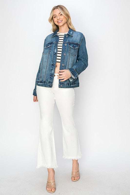 RISEN full size distressed button-up jacket with fraying, worn over a striped tee and white pants.
