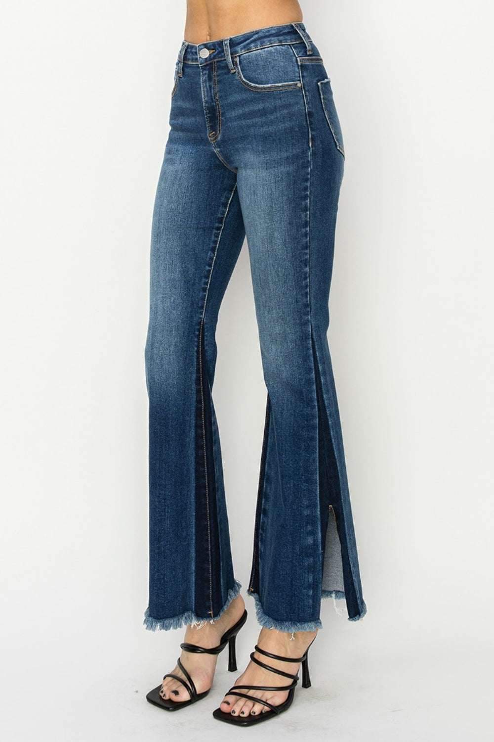 Full size high rise slit flare jeans with side shadow seam detail.