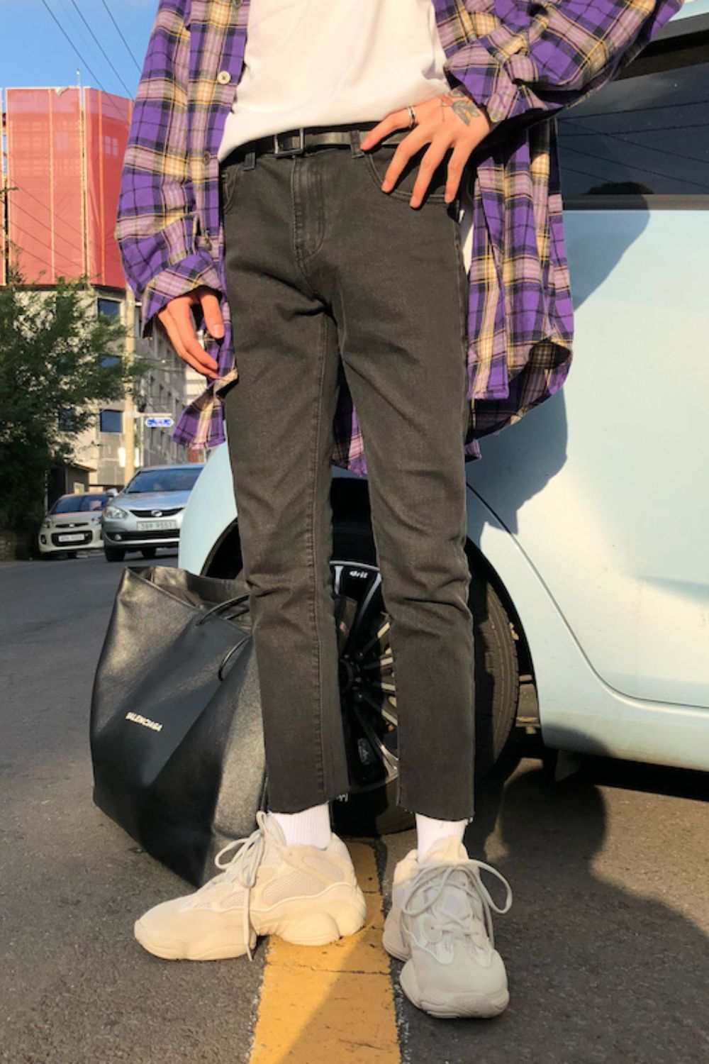 Men's slim fit jeans with pockets, featuring a basic style and dark color.