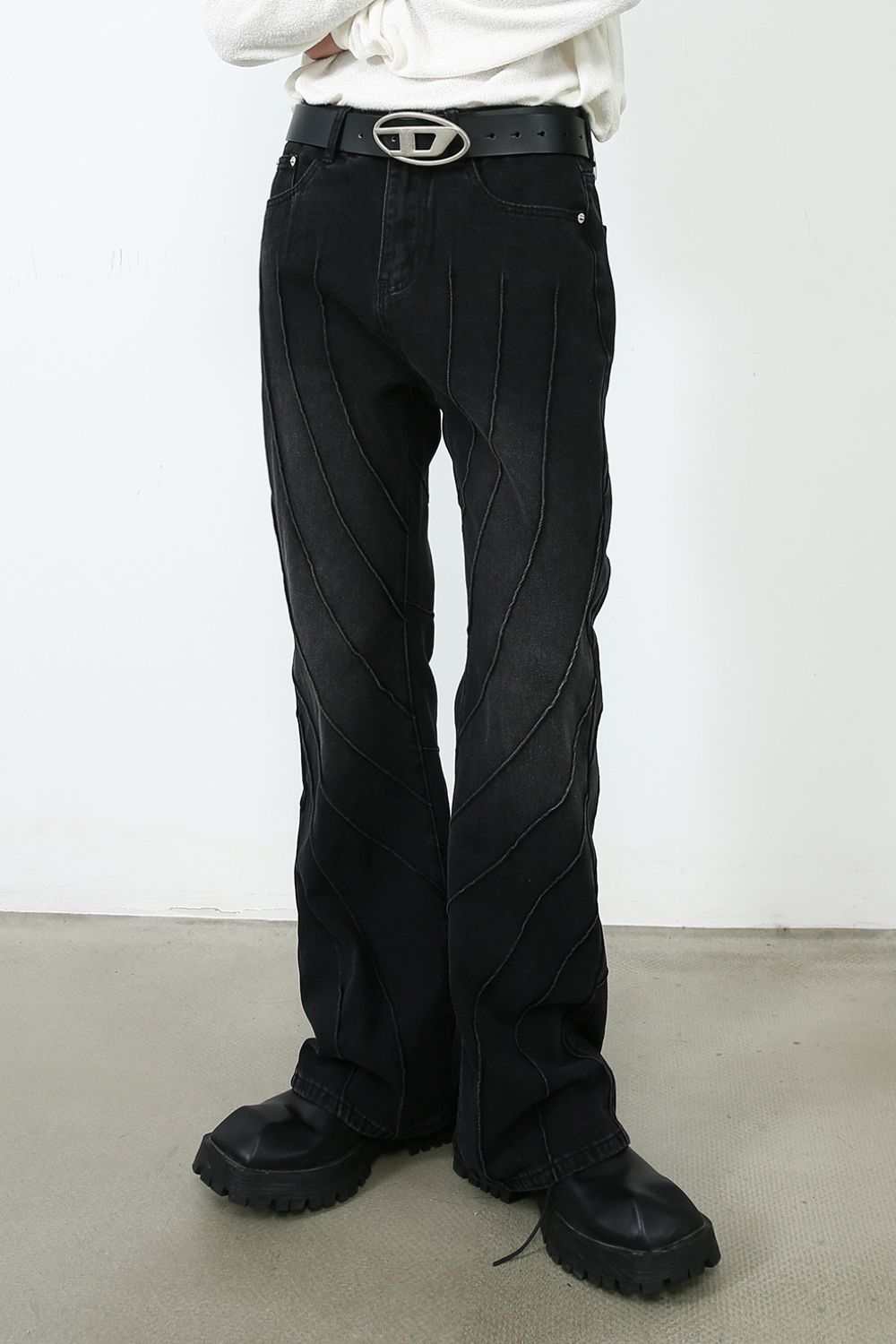 Men's exposed seam jeans with pockets, no stretch, black color.