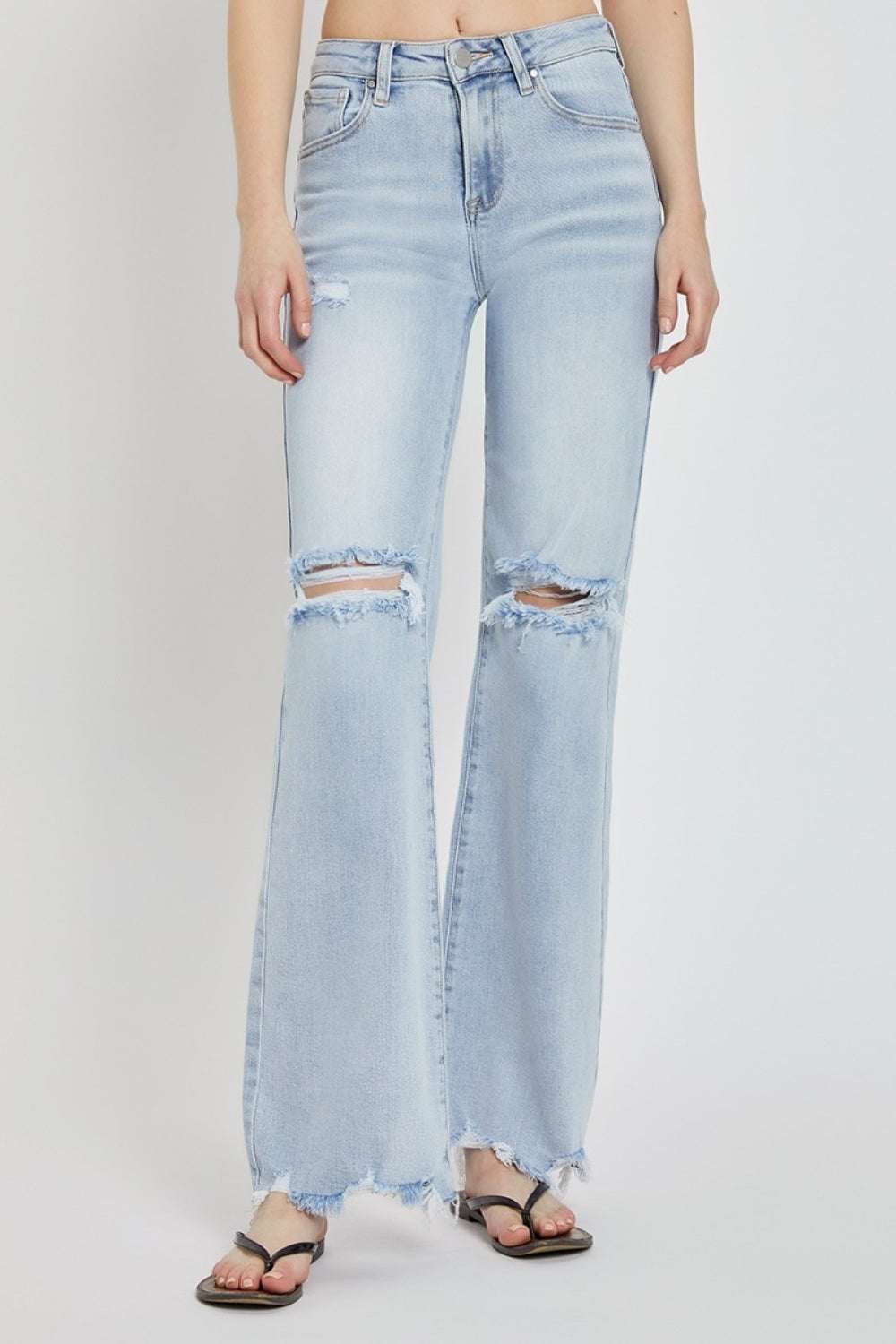 Full size high rise distressed wide leg jeans with raw hem and pockets.