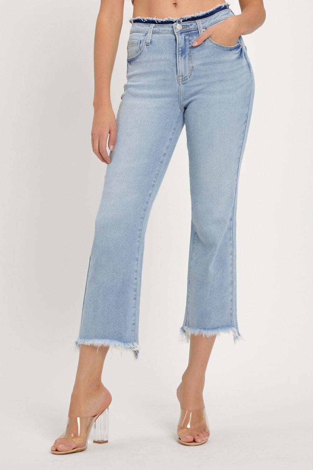 High rise raw edge crop jeans with a light wash and slightly stretchy fit.