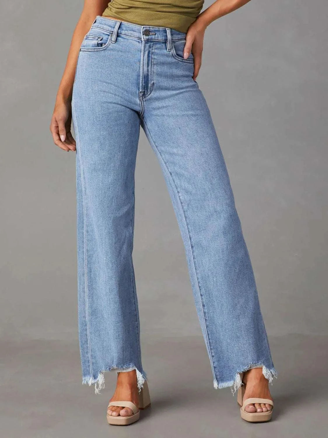 Raw hem loose fit jeans with buttoned pockets, no stretch, and 65% cotton material.