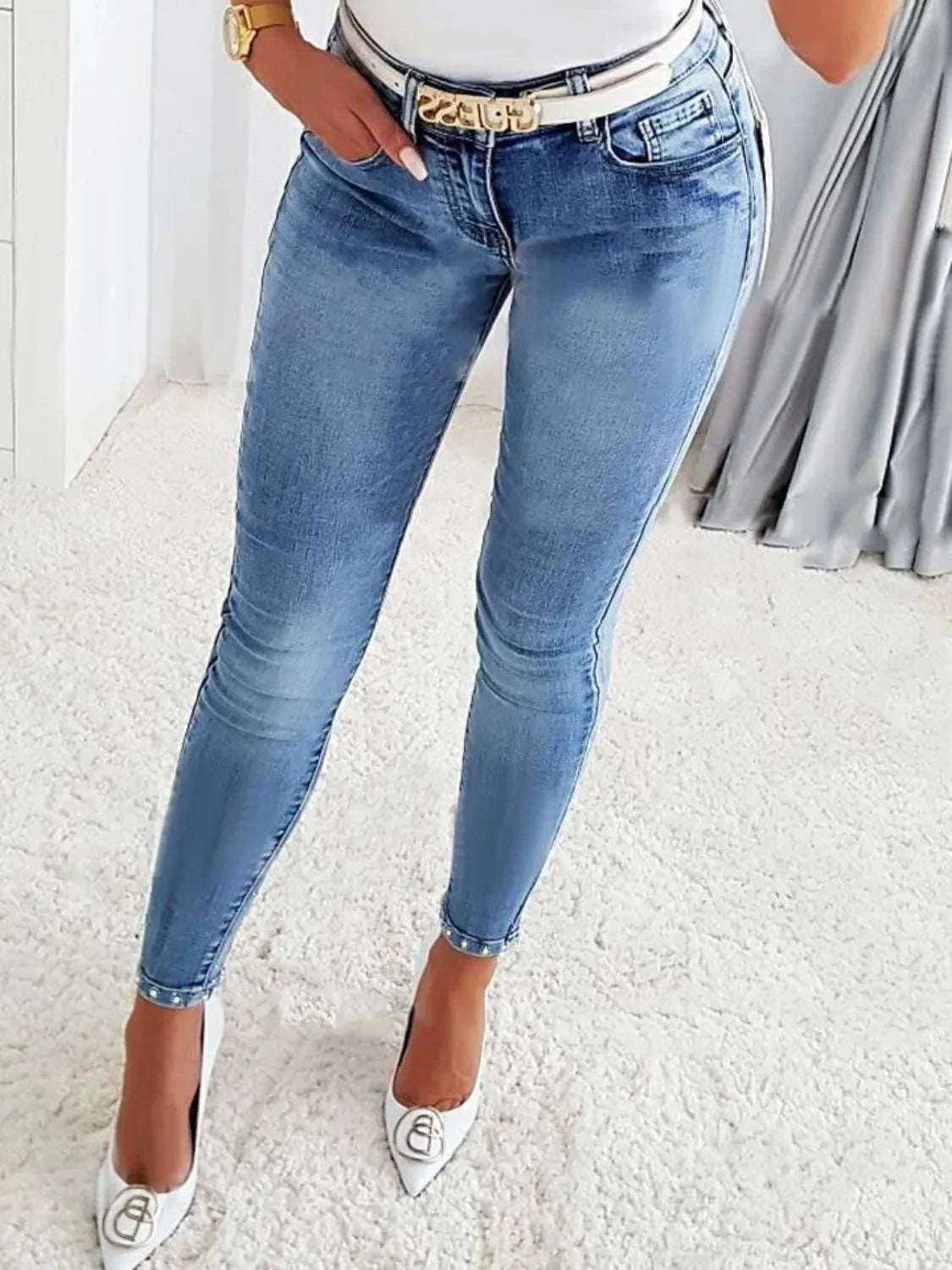 Rhinestone butterfly jeans with pockets, slightly stretchy, in light blue denim.