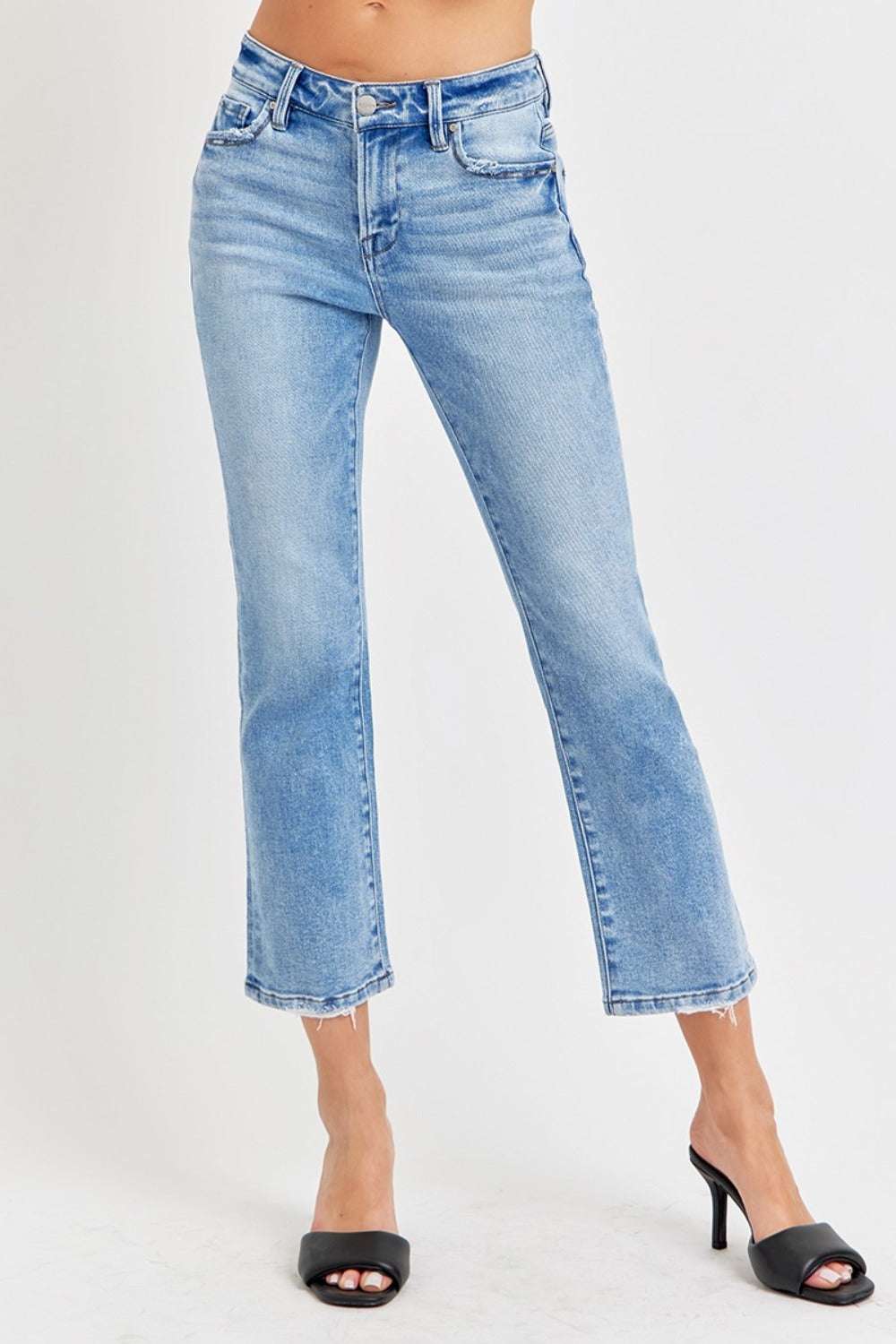 Full size low rise crop slim straight jeans with raw hem and washed finish.
