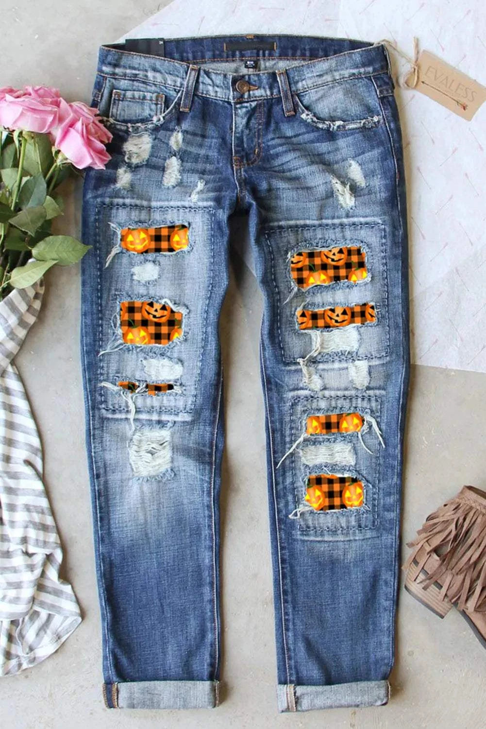 Distressed pumpkin pattern jeans with pockets and slight stretch.
