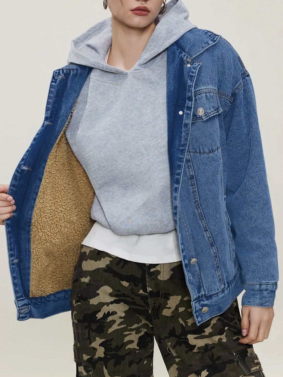 Button up long sleeve denim jacket with collared neck and pockets.