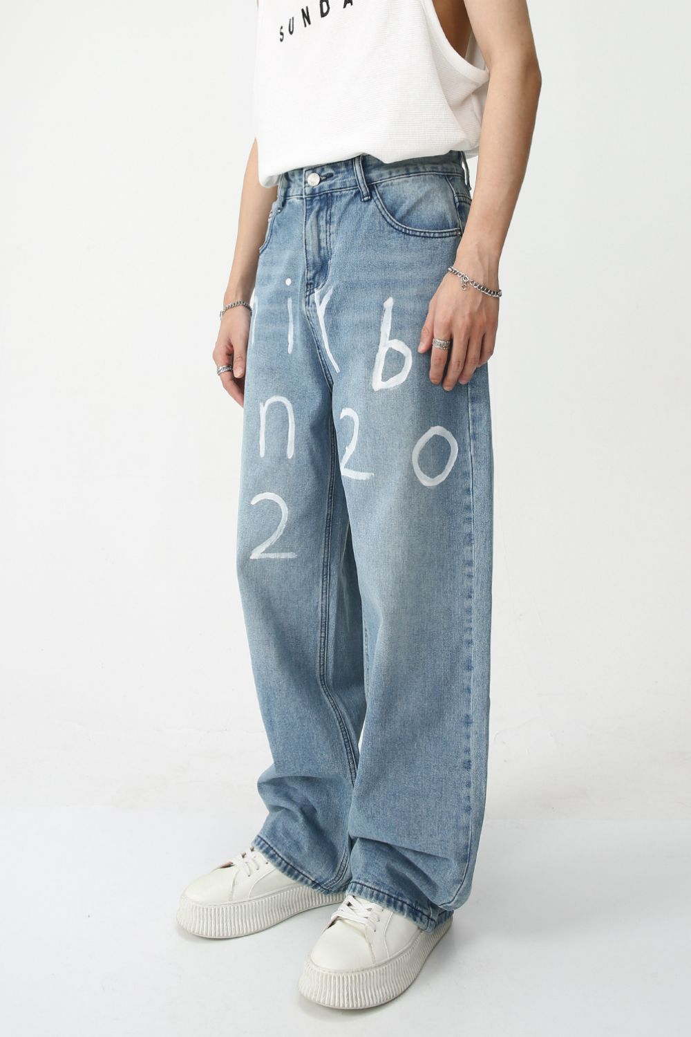 Men's graffiti wide leg jeans with white text details, basic style, no stretch, 85% cotton, 15% viscose.