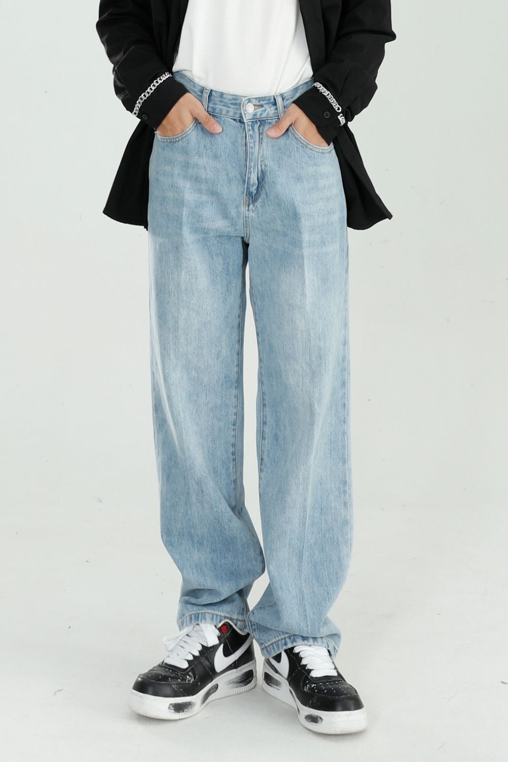 Mid Rise Wide Straight Jeans with Pockets in light denim.