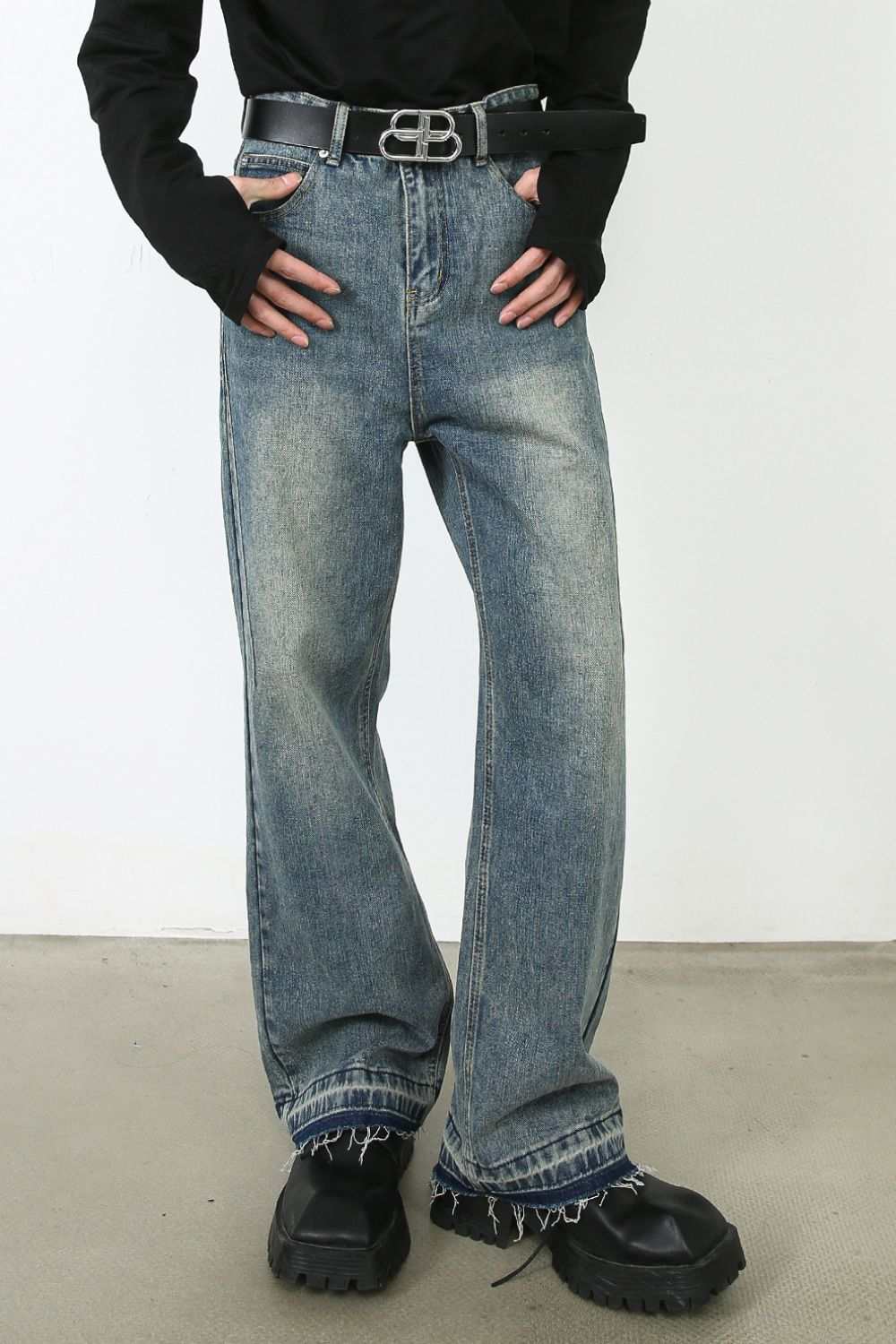 Men's frayed hem jeans with pockets, no stretch, cotton blend material.