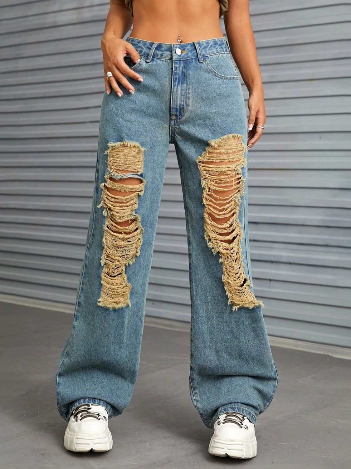 Distressed wide leg jeans with front pockets and frayed rips, slightly stretchy denim.