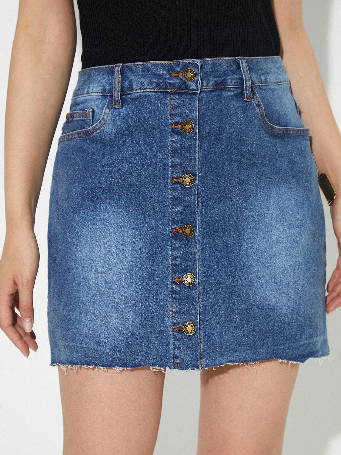 Pocketed button up denim skirt with front buttons and pockets.