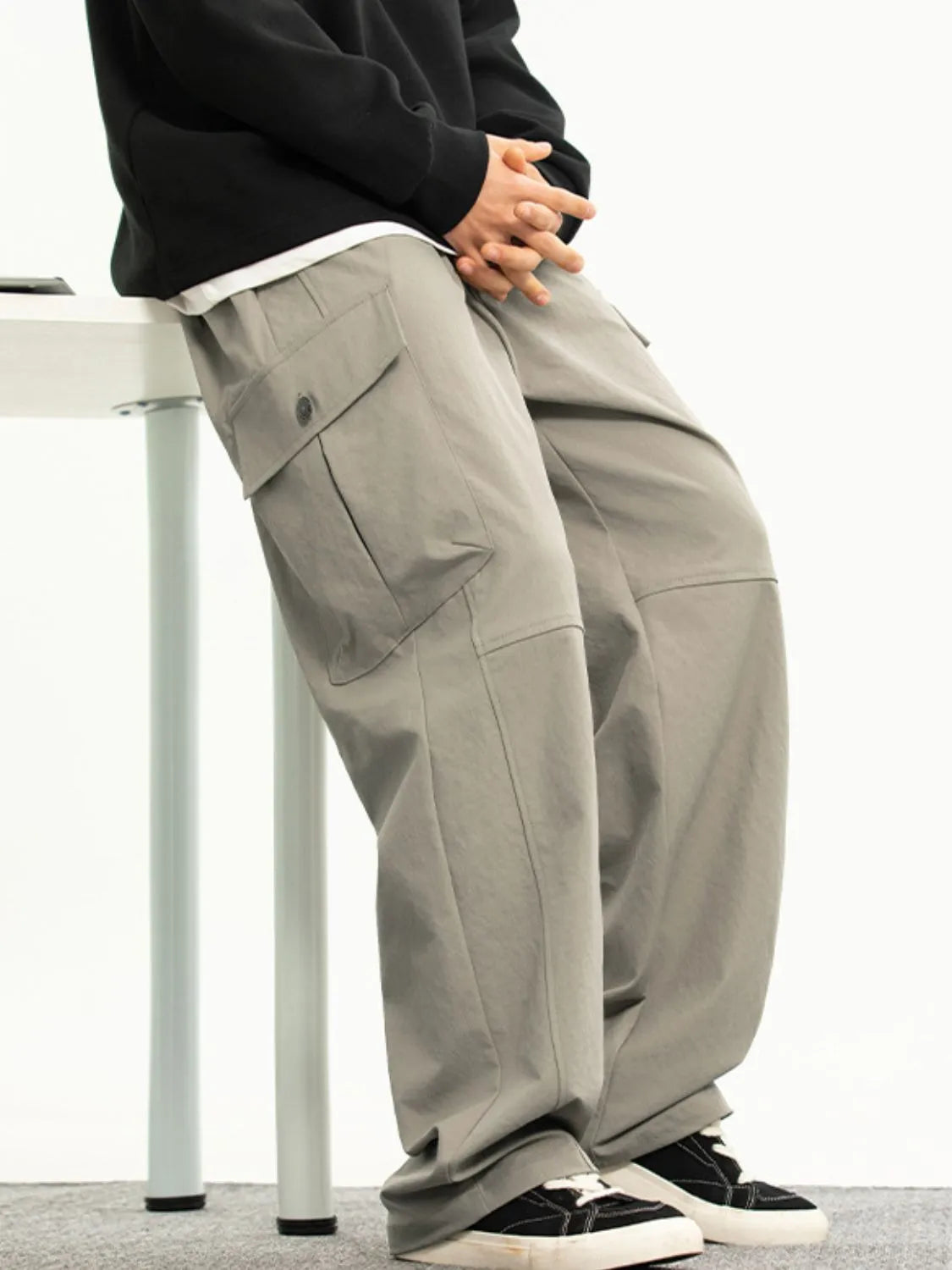 Men's plus size drawstring pants with pockets in polyester fabric.