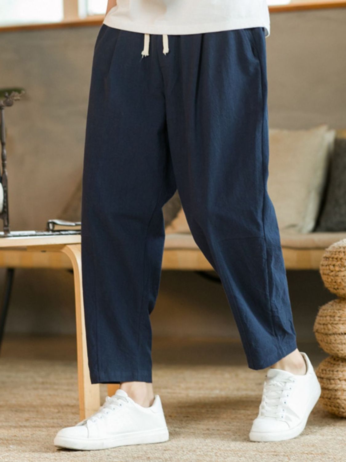 Plus size drawstring pants with pockets in navy blue, featuring a loose fit and casual style.