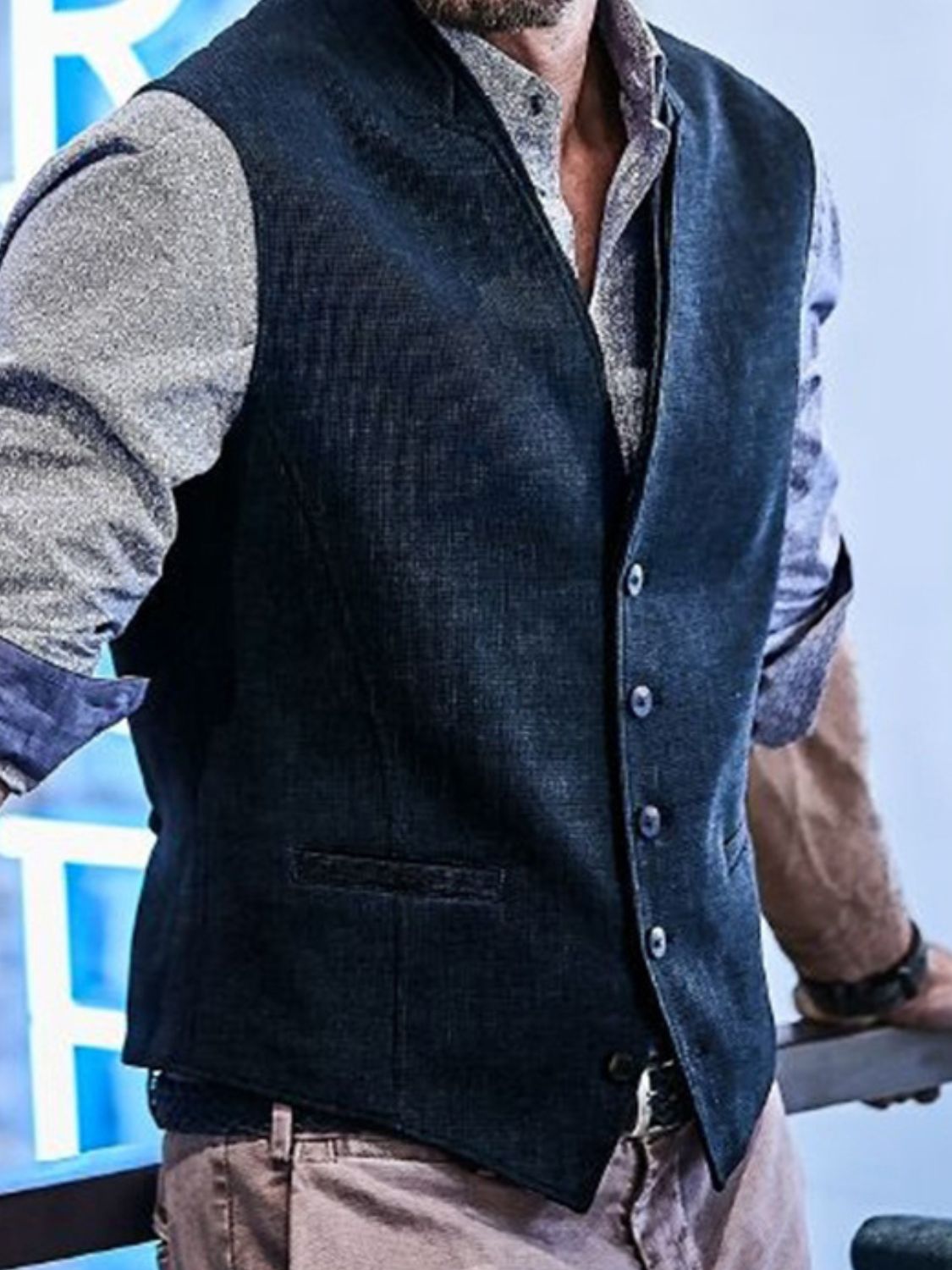 Men's full-size navy button-down vest, slightly stretchy, polyester-cotton blend.