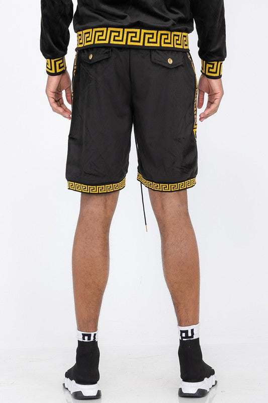 Status print velour suede shorts with elastic waistband and drawstring, featuring back button-closure pockets.