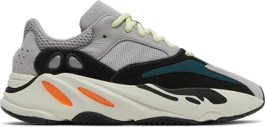 adidas Yeezy Boost 700 Wave Runner sneaker with multi-material upper, teal and blue overlays, vibrant yellow laces, and orange-accented off-white midsole.