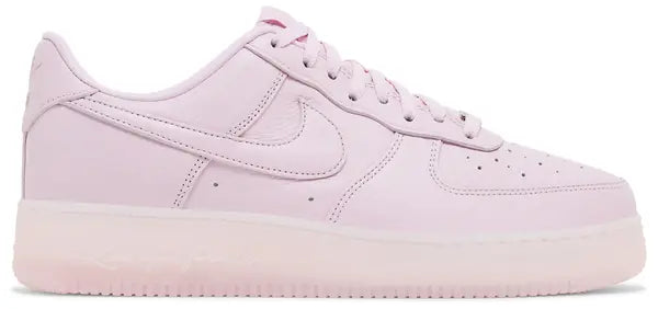 NOCTA x Air Force 1 Low 'Certified Lover Boy - Pink Foam' sneakers with pink tumbled leather upper and cobalt tint accents.