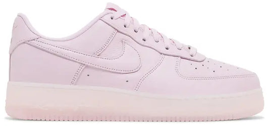 NOCTA x Air Force 1 Low 'Certified Lover Boy - Pink Foam' sneakers with pink tumbled leather upper and cobalt tint accents.