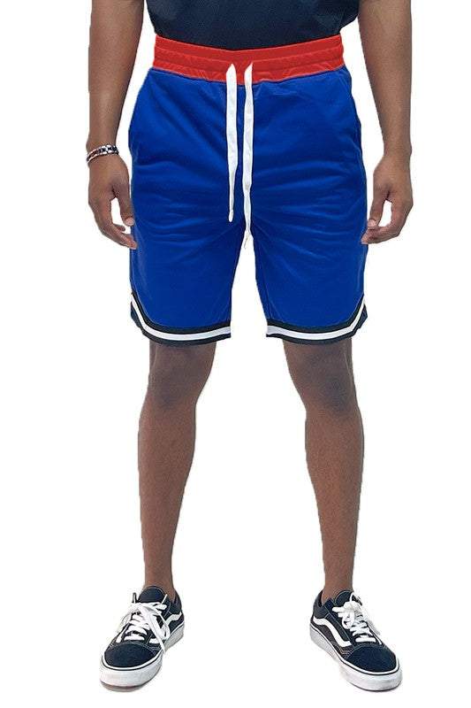 Solid athletic basketball sports shorts with elastic waist and drawstring in blue, featuring standard and single back pocket, 100% polyester.