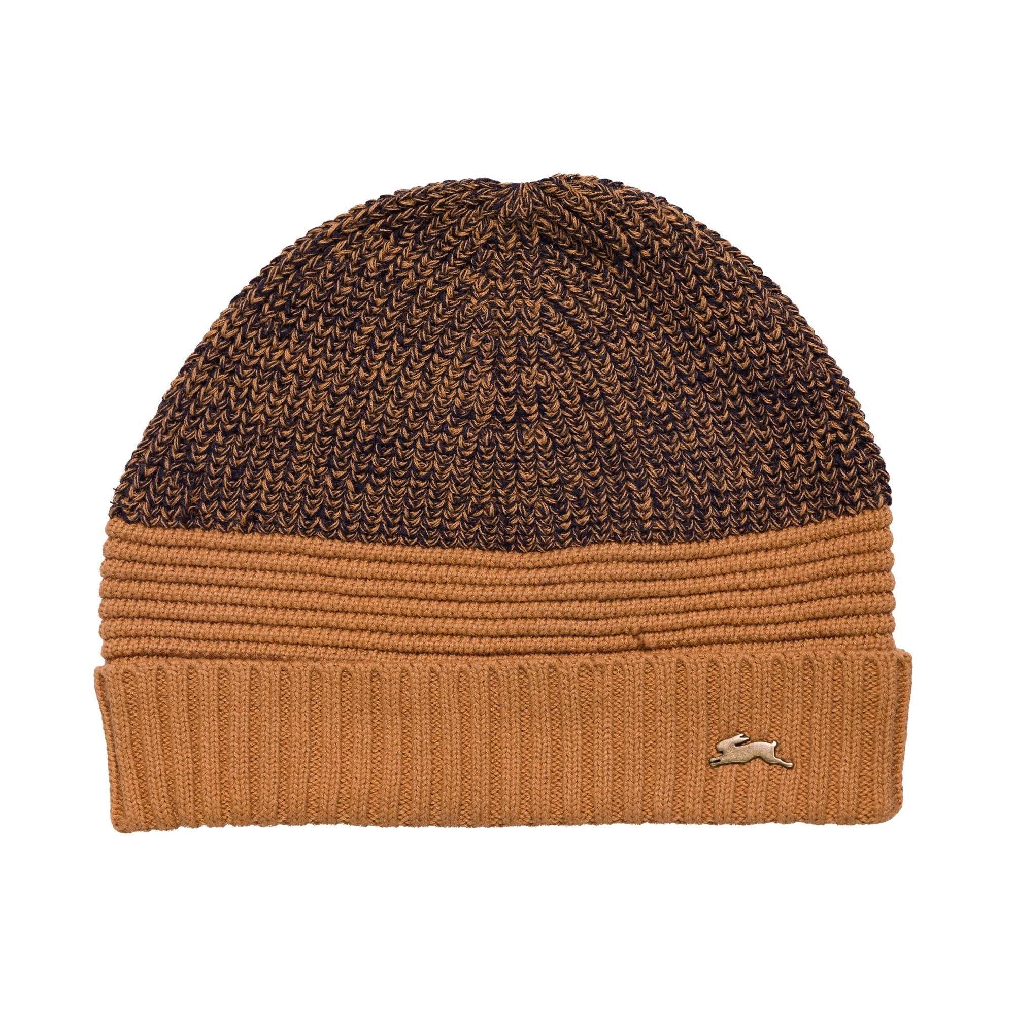 Carlos popcorn sweater knit beanie with ribbed edge and A.T rabbit pin.