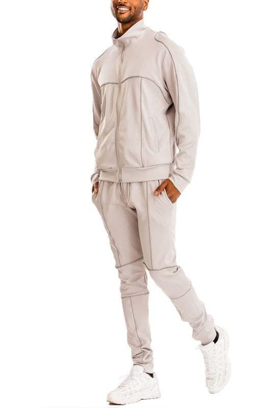 Reflective Piping Track Set with elastic waist and ankle cuffs, shown in a stylish color.