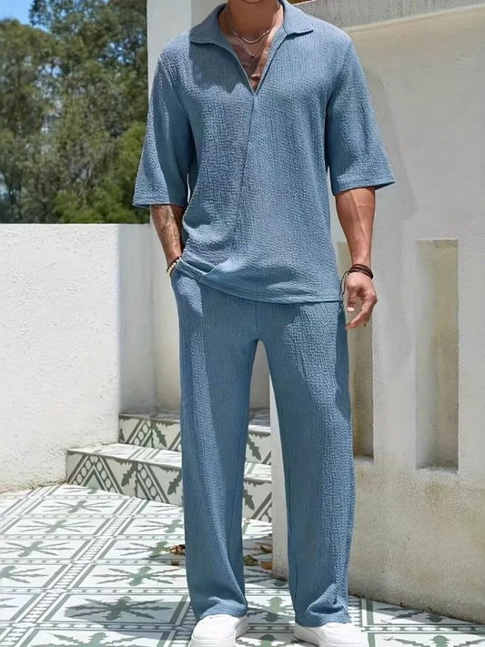 Men's Johnny Collar Half Sleeve Top and Pants Set in blue, outdoor setting.